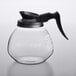 A Bunn glass coffee decanter with a black handle.