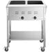 An Avantco stainless steel mobile electric steam table on wheels with an undershelf.