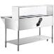 An Avantco stainless steel electric steam table with sneeze guard.