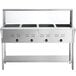 An Avantco stainless steel electric steam table with black knobs and sneeze guard.