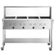 An Avantco stainless steel mobile electric steam table on wheels.