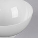 A Fineline white plastic tiny bowl.