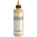 A Chefmaster bottle of metallic gold airbrush color with a yellow cap.