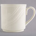 A white Homer Laughlin china mug with a wavy design on the handle.