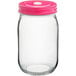 A clear glass Acopa Rustic Charm drinking jar with a pink metal lid.