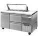 A stainless steel Continental Refrigerator sandwich prep table with drawers.