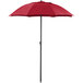 A red Lancaster Table & Seating umbrella with a black pole.