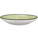 A white porcelain bowl with a black rim and lime green interior.