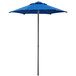 A blue Lancaster Table & Seating umbrella on a metal pole on a white background.