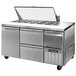 A Continental Refrigerator stainless steel sandwich prep table with drawers and doors.