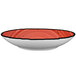 A white porcelain pasta bowl with a red rim and black accents.