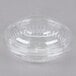 A close up of a Dart clear plastic bowl with a dome lid.