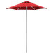 A close up of a red Lancaster Table & Seating umbrella on a pole.