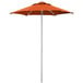 A Lancaster Table & Seating papaya orange push lift umbrella with aluminum pole.