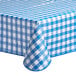 A Choice royal blue and white checkered vinyl table cover with flannel back on a table.