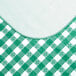 A green and white checkered vinyl table cover with a textured gingham pattern.