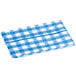 A Choice royal blue and white gingham vinyl table cover with flannel back on a table.