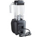A Hamilton Beach commercial bar blender with a black base and clear container with a cord attached.