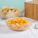 A white Cambro pebbled serving bowl filled with goldfish crackers.