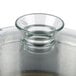 A clear glass bowl on top of a Robot Coupe cutter bowl.