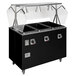 A black rectangular Vollrath hot food station with enclosed storage and glass covers.