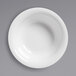 A white American Metalcraft Jane Collection melamine bowl with a white rim on a gray surface.