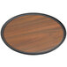 An American Metalcraft round wood serving tray with a black rim.