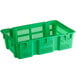 A green plastic agricultural crate with vents.