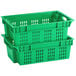 Two green vented agricultural crates stacked on top of each other.
