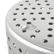 A close up of a stainless steel Vollrath fryer basket with holes in it.