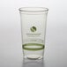 A clear Fabri-Kal greenware plastic cup with a green label.