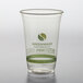A clear Fabri-Kal Greenware plastic cup with a green design.