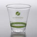 A clear plastic Fabri-Kal cup with a green Greenware logo.
