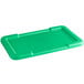 A green plastic tray with a recessed lid.