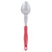 A Vollrath Jacob's Pride heavy-duty basting spoon with a red handle.