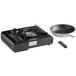A black Choice portable 1-burner butane stove with a frying pan on top.