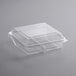 A clear plastic PET bakery container with a hinged low dome lid.