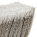 A close up of a Carlisle push broom head with gray flagged bristles.