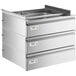 A Regency stainless steel triple-stacked drawer set on a metal counter with white labels on the drawers.