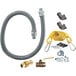 A grey Dormont gas hose kit with yellow restraining cable and fittings.