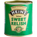 A Heinz #10 can of Deluxe Sweet Relish on a table in a deli.