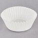 A white paper Hoffmaster fluted mini baking cup.