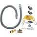 A Dormont gas hose kit with fittings, a grey hose, yellow cable, and other parts.