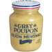 A Grey Poupon Dijon Mustard jar with a blue lid.
