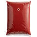 A red plastic bag of Heinz ketchup with a white label.