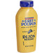 A Grey Poupon Dijon Mustard squeeze bottle.