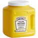 A yellow Heinz container with a white lid.