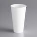 A Dart ThermoGuard white paper hot cup on a gray surface.