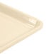A beige Cambro dietary tray with a handle.