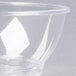A clear plastic Fineline Savvi Serve bowl on a white surface.